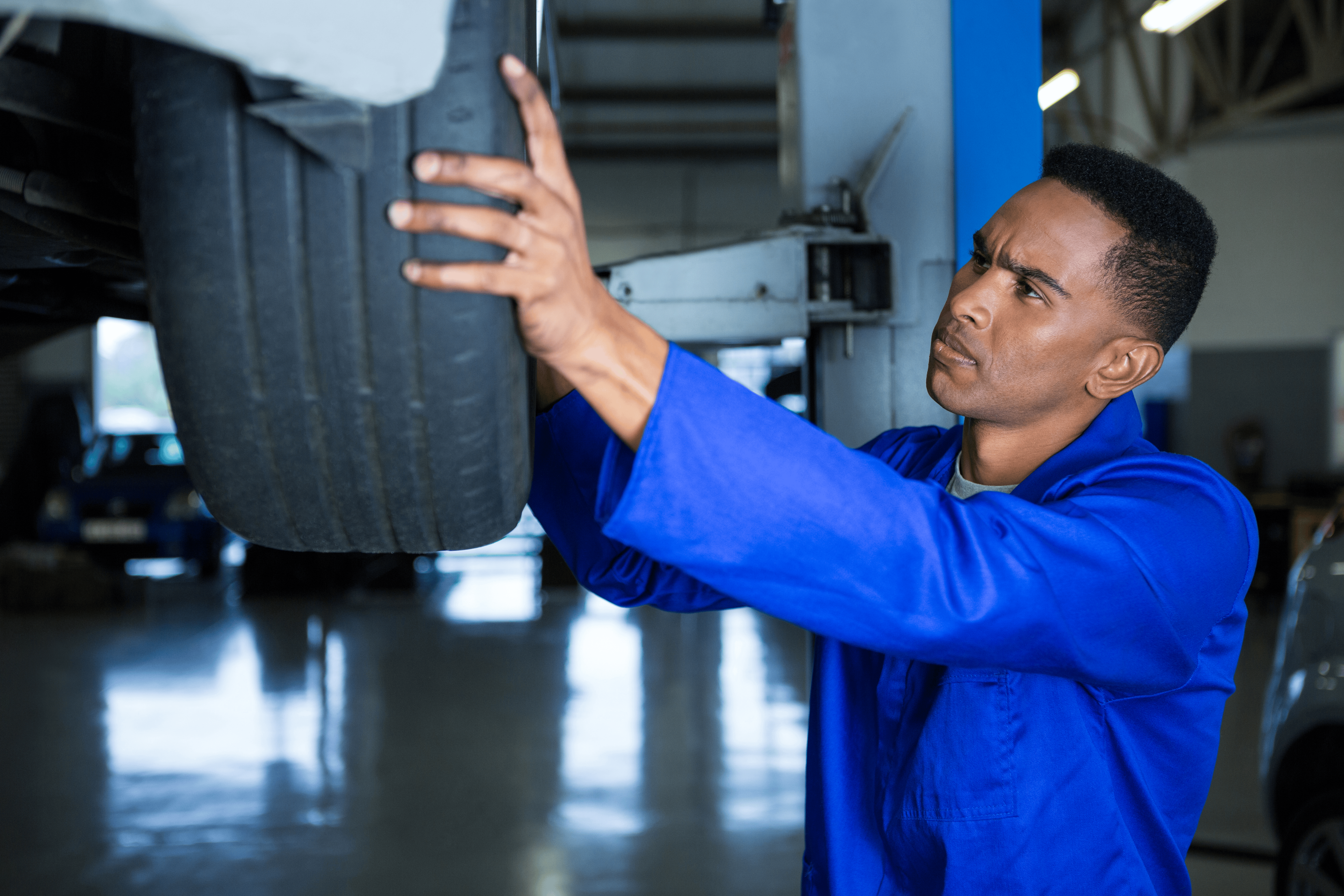 Tyre fitment workshop in Cape Town with car on hoist